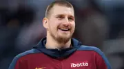 Nikola Jokic's MVP Dream in Jeopardy: Knee Injury Sidelines Nuggets Star for a Month