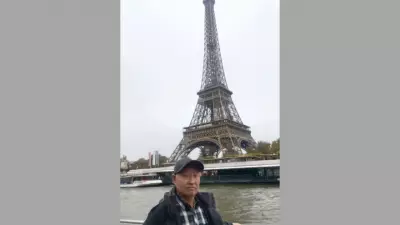 Retired Chinese Tourist's Rainy Paris Photos Go Viral for Raw Honesty