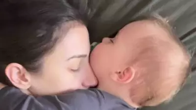 Viral Video of Sleeping Baby's Hug Sparks Emotional Motherhood Conversation