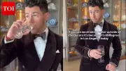Nick Jonas Wears Kalava, Sips Water Ahead of Oscars with Priyanka Chopra