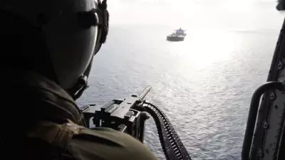 US Navy Helicopter Confronts Ship in Strait of Hormuz Amid Regional Tensions