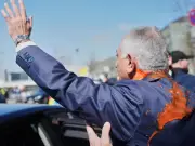 Iran's exiled prince Reza Pahlavi splashed with red liquid in Berlin attack