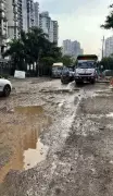 Noida Residents Demand Road Repairs After School Bus Gets Stuck in Pothole