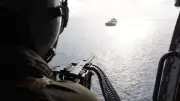 US Navy Helicopter Confronts Ship in Strait of Hormuz Amid Regional Tensions
