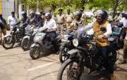 Ballari Deputy Commissioner Leads Helmet Awareness Rally on Motorcycle