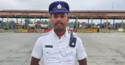 Bengaluru Traffic Cop Carries Differently Abled Man During Heavy Rains, Wins Hearts