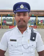 Bengaluru Traffic Cop Wins Hearts for Carrying Disabled Man Through Waterlogged Road