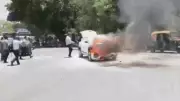Car Engulfed in Flames on Delhi Road Amid Intense Heat, Panic Ensues