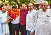 Former Haryana IAS Officer Honored in Village for Public Service