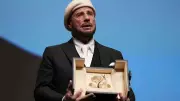 John Travolta Surprised with Honorary Palme d'Or at Cannes Premiere