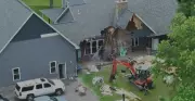 Man Arrested for Using Excavator to Destroy Home with Family Inside