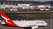 Qantas passenger banned for life after biting flight attendant mid-air