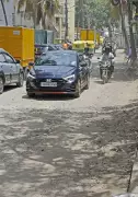 Bengaluru's Haralur Road: Potholes, Sewage, and Daily Commuter Ordeal