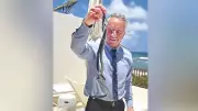 RFK Jr. Goes Barefoot Snake Catching at Oz's Beach House, Internet Reacts