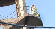 Woman climbs water tank over police inaction, rescued after hours