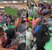 Indians in New Jersey push and grab carts during Rs 190 parval sale